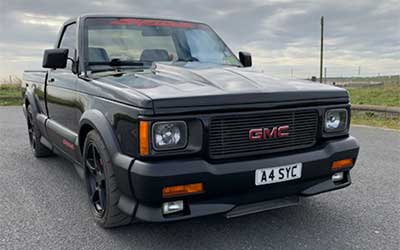 GMC Syclone all the plastic cladding repainted in matte black.