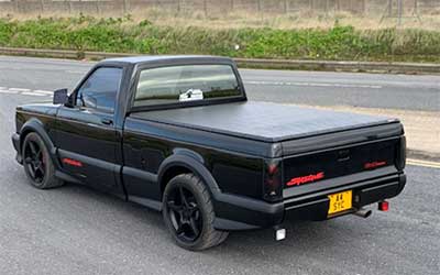 GMC Syclone all the plastic cladding repainted in matte black.