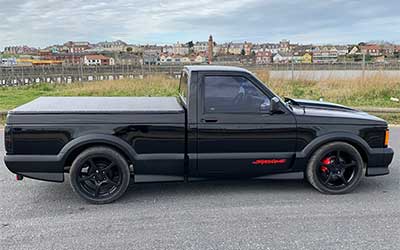 GMC Syclone all the plastic cladding repainted in matte black.